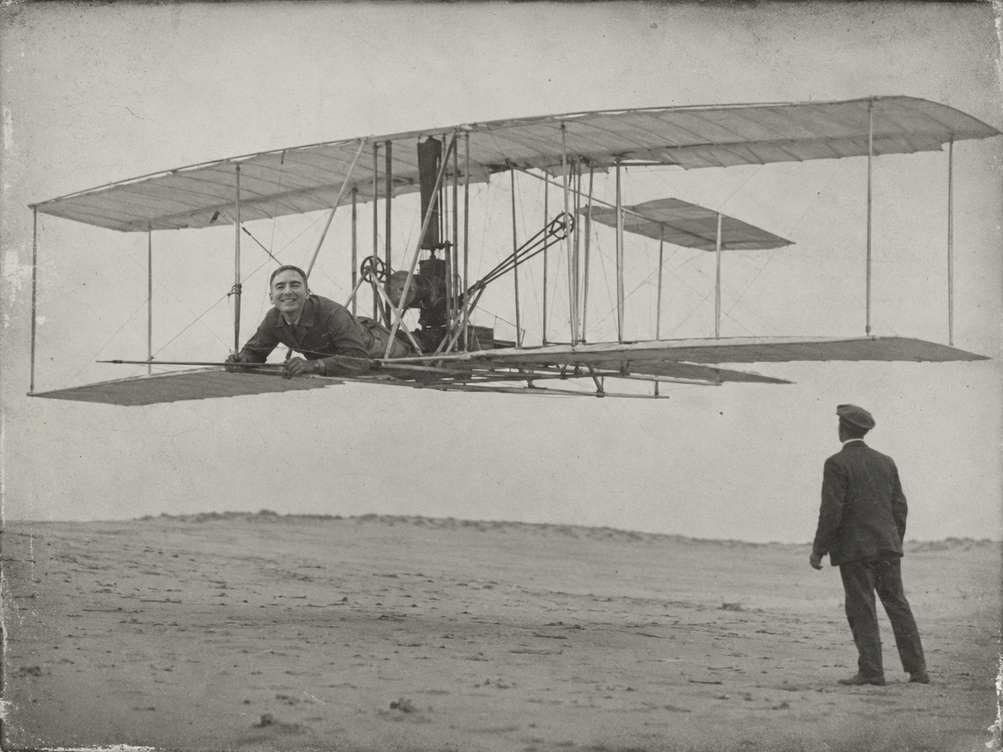 Matthew Black lying prone at the controls of the Flyer in flight